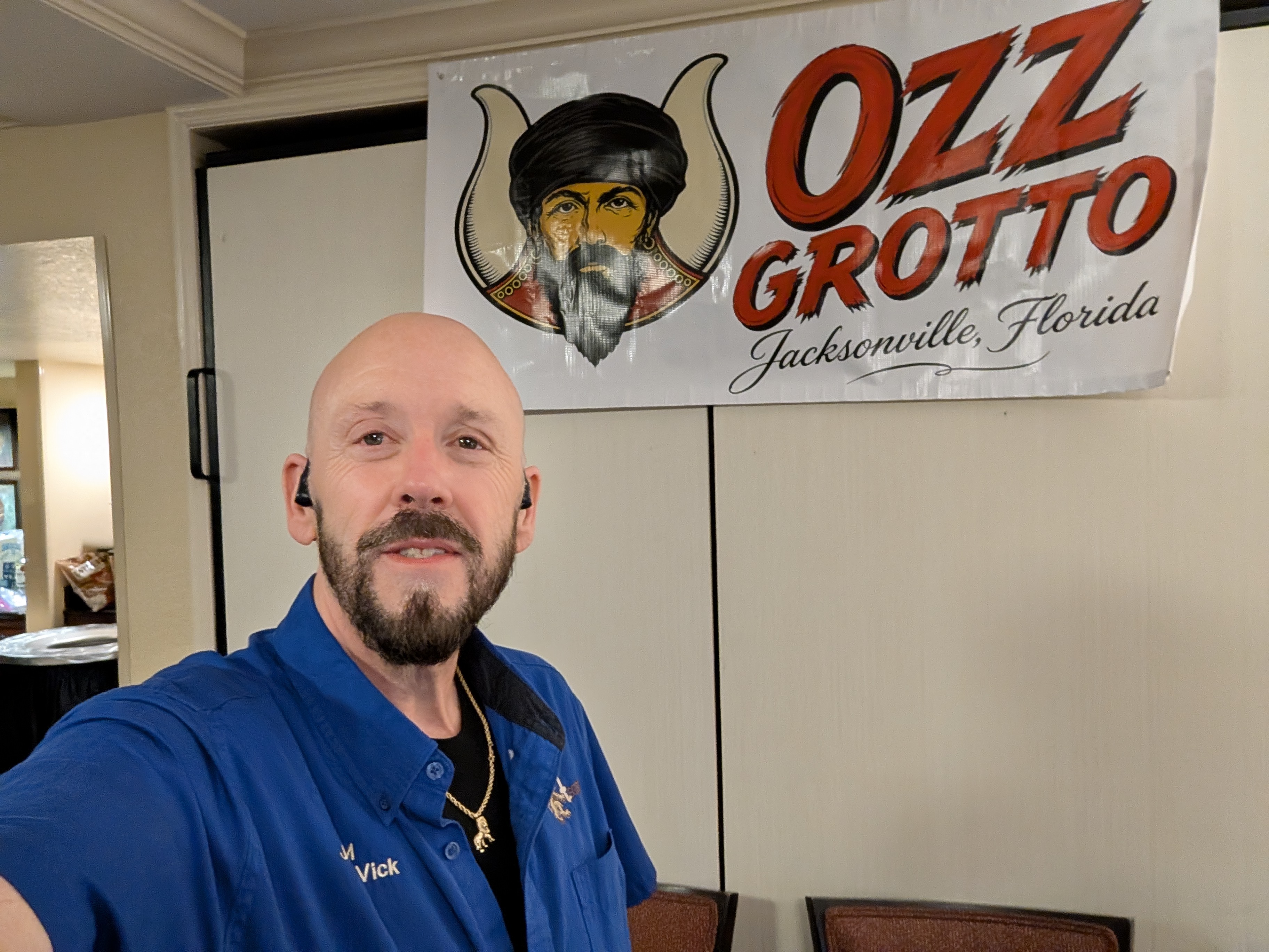 Ozz Grotto banner displayed at an event